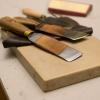 Paring knives and lithographic stone

